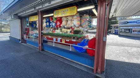 Players throw a ring on a bottle to win a prize