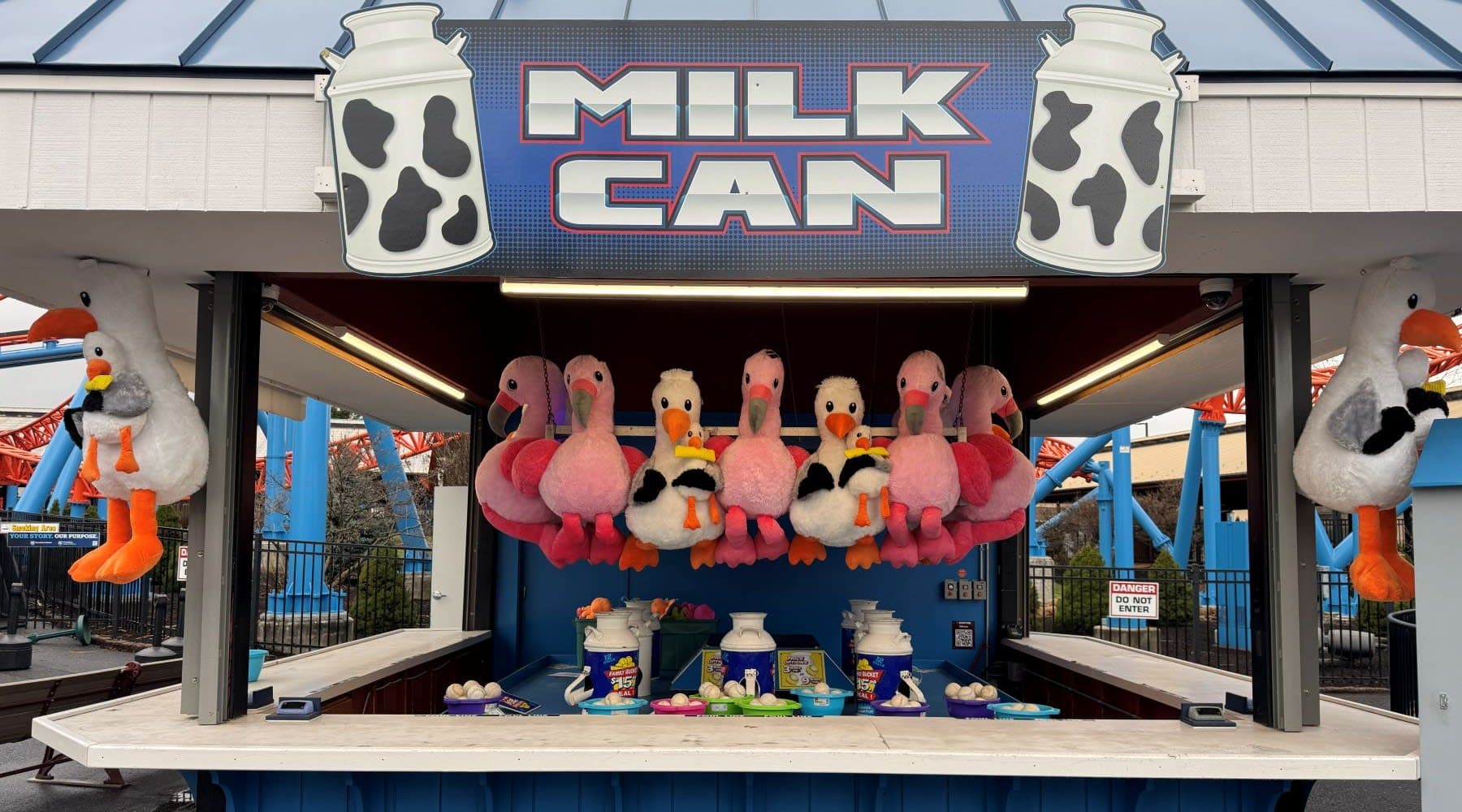 Toss the softball and try to land in the top of the milk can