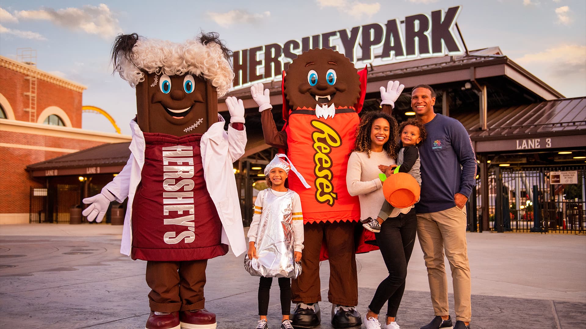 Family In Costumes At Front Gates Hersheypark Halloween
