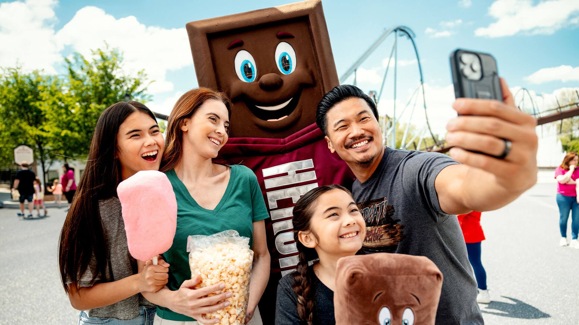 family-taking-selfie-with-hershey-bar-character-hersheypark.jpg