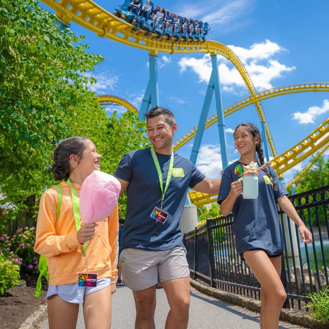 father-and-two-daughters-walking-with-skyrush-in-background.jpg